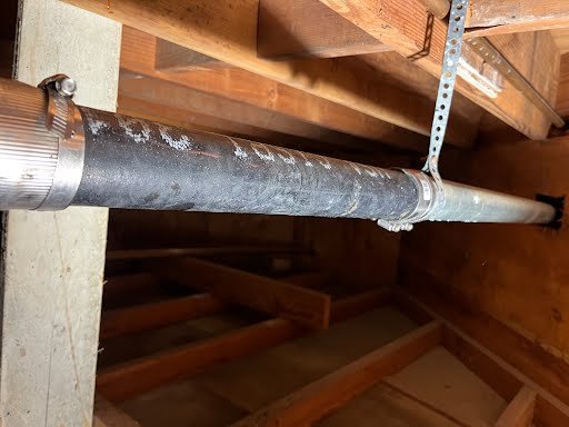 Plumbing vent stack inspection in New York attic
