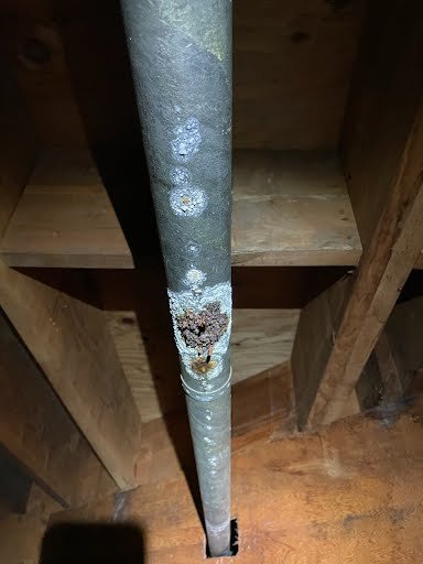 Close up of corroded leaking pipe requiring emergency repair